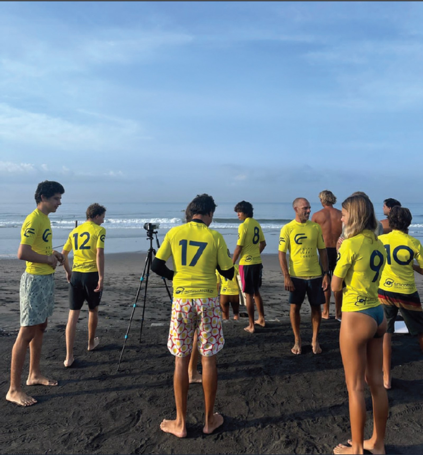 The Wisdom Academy surf team on the beach during a coaching and filming session